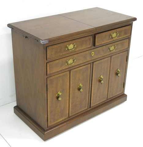 Banded mahogany bar cabinet: Split top. Possibly Henredon. Approx. 31" H x 36" W x 18" D.
