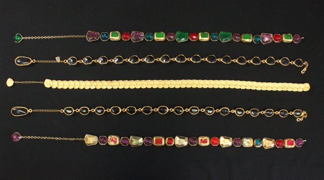 Lot of Kenneth Lane belts: Including: 1- Kenneth Lane multi colored stone belt, approx. 26.5" L with 7.75" adjustable belt. 1- Kenneth Lane style black stone belt, approx. 28.5" L with 4" adjustable chain. 1- Kenneth Lane multi