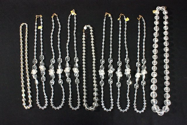 Lot of crystal & lucite necklaces: Including: 9- Kenneth Lane crystal necklaces, approx. 35" L each. 1- Cener crystal necklace, approx. 36" L. Shortest necklace approx. 30" L, longest 38" . Good condition.