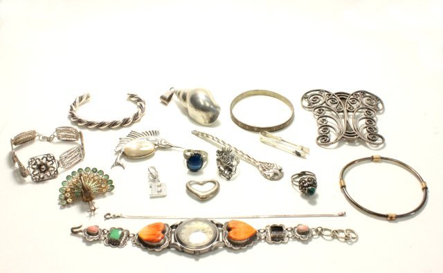 Lot of vintage silver: Including: Tiffany & Co. "Heart" pendant, Tiffany & Co. tongs, watch with stones. Total 5 bracelets, 3 rings, 1 watch, 3 brooches, 3 pendants, 1 tong & 1 caviar spoon. = 17 pieces. Watches are working
