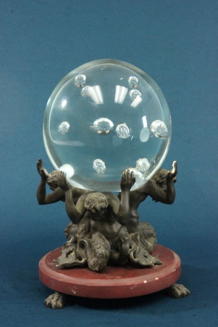 Venetian Glass Ball on Bronze & Marble Base: Glass ball mounted on bronze figural and rouge marble base. Etched R Auotra, stamped Vetri Murano on bottom of the bowl. 3 bearded man holding up ball. Approx. 9 1/4" high. Small chip underside of mar