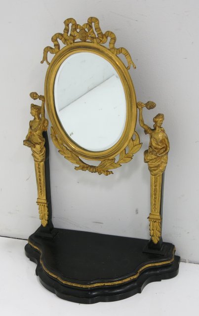 Louis XVI style table top vanity mirror: Figural gilt bronze. Frame approx. 18" H, mirror approx. 15" H, total height approx. 25" H.