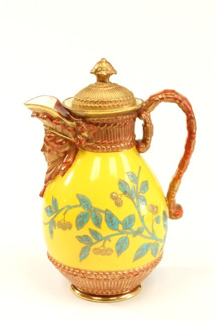 19th C Royal Worcester Figural Pitcher: Marked on the bottom - Patent Metallic. Yellow background with copper color highlights. Approx. 7 1/2" high. Some old restorations