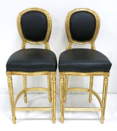 Pair mid century Louis XVI style bar stools: Gold frame, black vinyl cushions & backs. Good condition