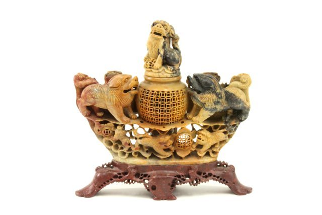Carved Chinese soapstone incense burner: Carved lions surrounding with carved Foo dogs top. Approx. 12" H x 12" W. From a Bergen County, NJ estate.