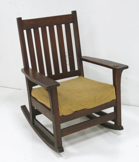 L. & JG Stickley oak rocker: Stamped under left arm. Original finish. Fabric cushion seat. (3505)