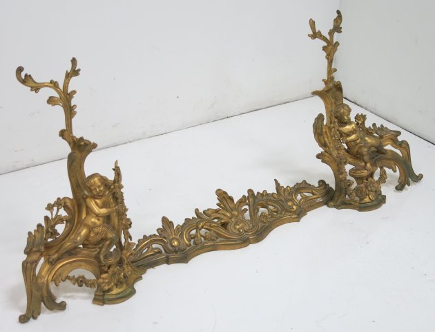 Pair gilt bronze figural chenets & fender: Putti & floral design, 19thc/20thc, 21"H Good condition