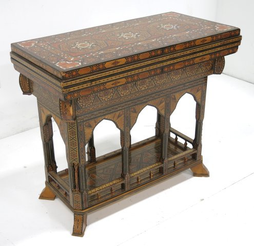 Moorish inlaid backgammon/games table: 30"H x 35 1/2"W x 17 1/2"D damages to inlay