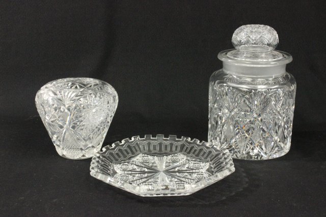 3 pieces cut glass: Including 1 bud vase, approx. 5"; 1 tray, approx. 9.5" D; 1 covered cookie jar, approx. 9.5" H. (3507) Chipping to lid interior.
