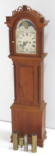 Diminutive Grandfather clock: Sun/moon dial, 3 weights & pendulum. Approx. 47" H. Missing finials, damage to top cut out.