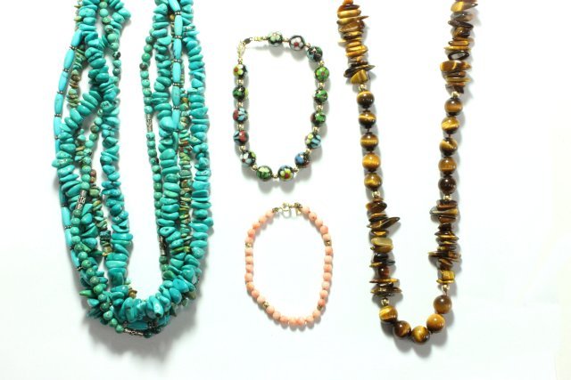 Group lot of necklaces & bracelets: Including 18kt gold & tiger eye necklace, 14kt gold & coral child's bracelet, 14kt gold & cloisonné bracelet, turquoise & silver necklace.