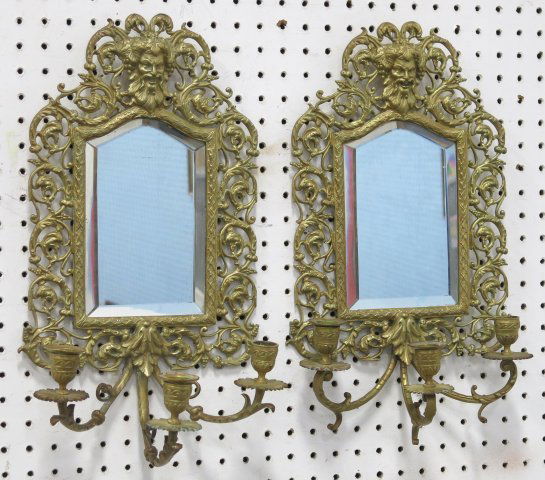 Pair bronze figural mirrored 3 arm sconces: Approx. 17" H. Missing 2 bulbashes.