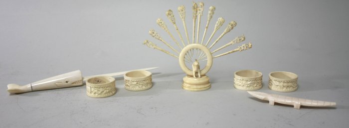 Chinese bone items: Including, toothpick holder, napkin rings, letter opener, & small crocodile. 7 pieces in total. Letter opener approx. 9.5". From a Long Island, NY estate. Good condition.