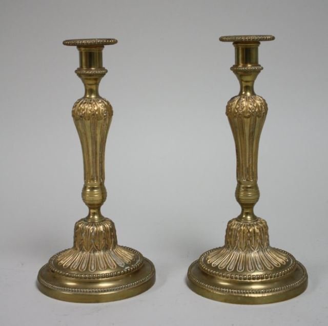 Pair of bronze ormolu candlesticks: Stamped Fress, Portugal. Approx. 10.5" H. Good condition.