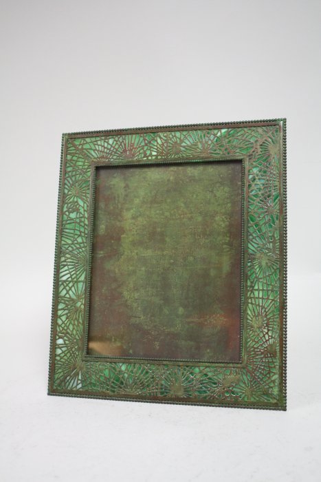 Tiffany Studio's frame: "Pine Needle" pattern, green slag glass & bronze. Fits 8" x 10" picture, approx. 14.25" x 12". Good condition.