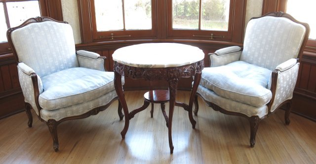 Pair Country French style Bergere chairs & table: Down cushions & round marble top table. Approx. 28" D x 28.5" H, chair 38" H x 29" arm to arm.