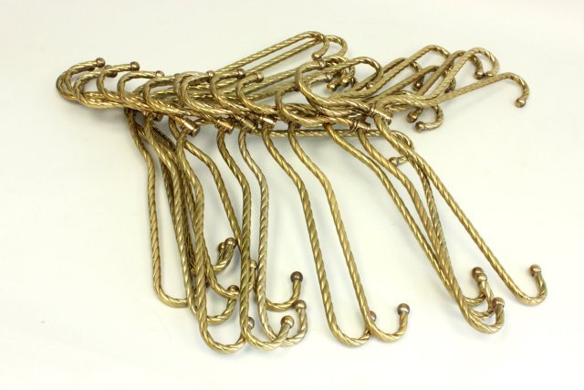 Tommi Parzinger 15 brass coat hangers: Ca. 1956. Each approx. 18" W. From an Ocean, NJ estate. A few slightly bent.