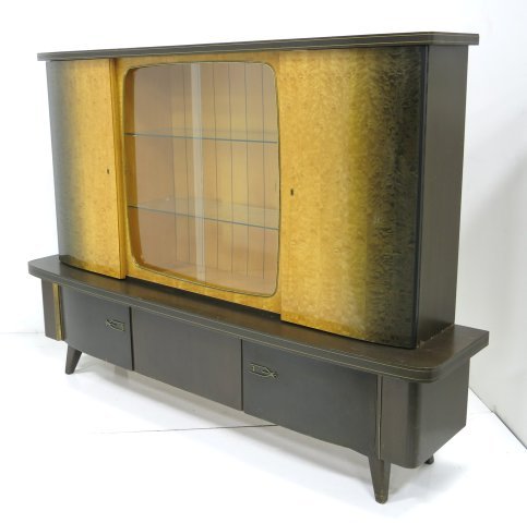 Modern German cabinet: Label on door, "Mustering Mobel". Approx. 59" H x 18" W x 76" L.