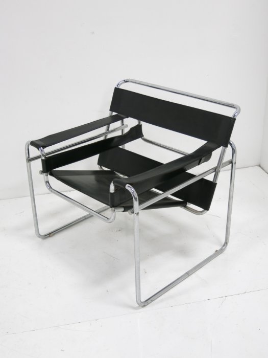 Marcel Breuer "Wassily" chair: Circa 1980. Labeled, Made in Italy. Approx. 29.5" H x 32.25" W x 26.25" D. Minor pitting mostly on underside.