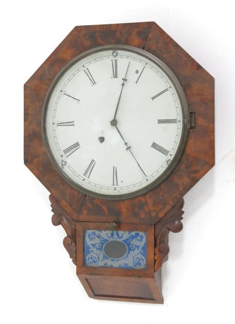 American walnut Victorian wall clock: With pendulum. Approx. 24" H. Good condition.