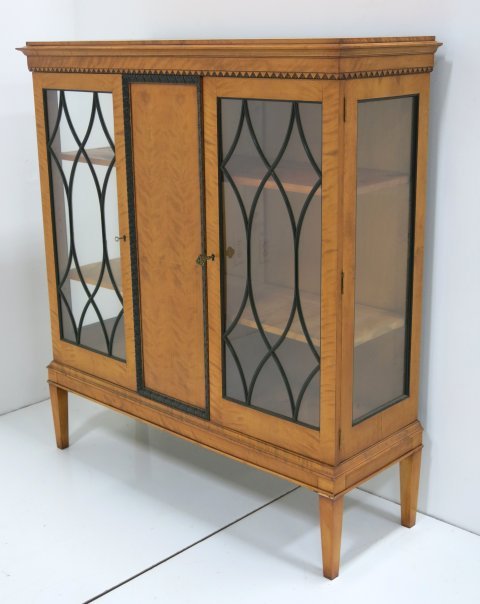 2 door light wood Scandinavian bookcase: Mullion doors. Approx. 51.5" across x 17" D x 56" H. Good condition.