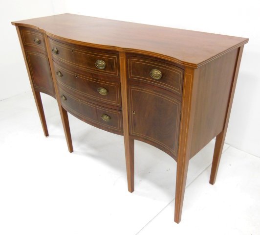 Mahogany Hepplewhite style sideboard: Pencil inlaid drawers, serpentine front. Ca. 1940's. Approx. 21" D x 60" x 39.75" W. (3392)