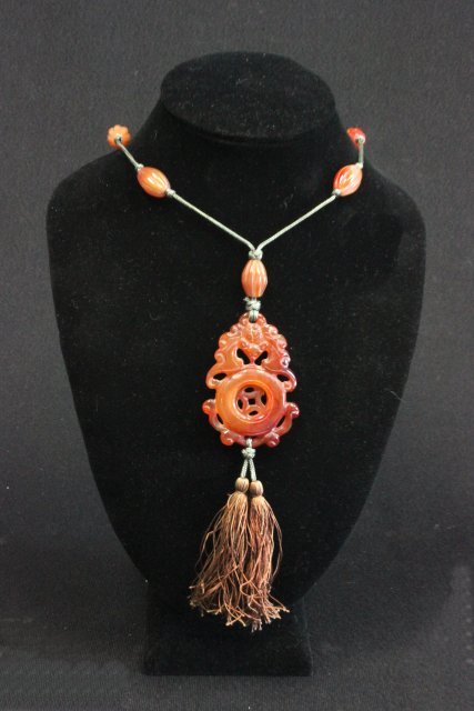 Chinese carved carnelian necklace: Approx. 18" L, bottom drop is 2" L. Good condition.