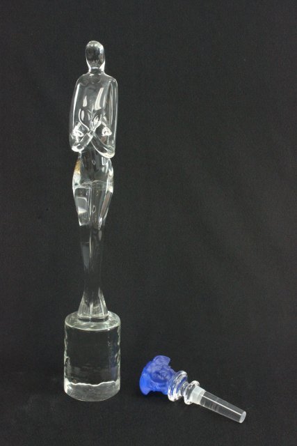 Crystal "Nude" & "Medussa Head" bottle stopper: Bottle stopper etched, Rosenthal Versace. Nude approx. 13.5" H, bottle stopper 5" H. Good condition.