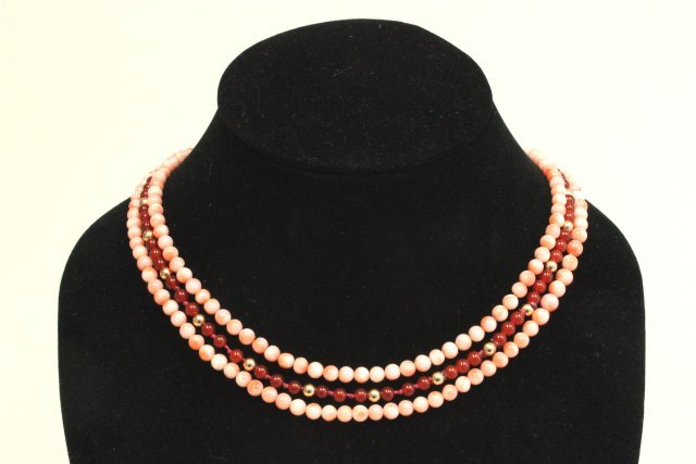 3 necklaces: 14kt gold & carnelian, 2 coral necklaces. Good condition.
