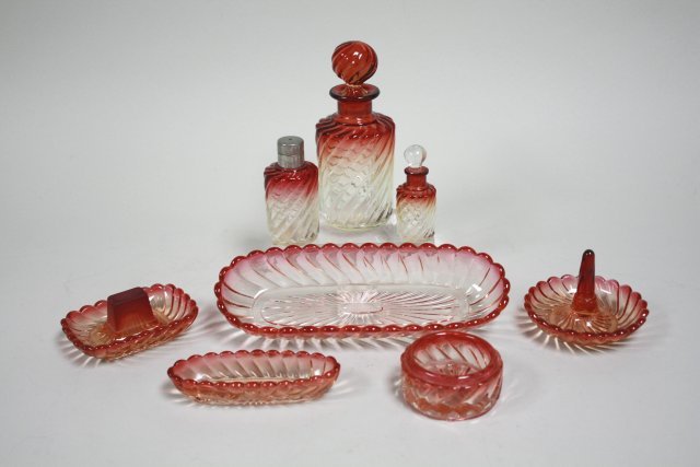 Baccarat Rose Tint Glass vanity set: Including, 3 trays, ring holder, box & 3 bottles. 8 pieces total. Signed Baccarat. Largest bottle approx. 7" H. (4022)