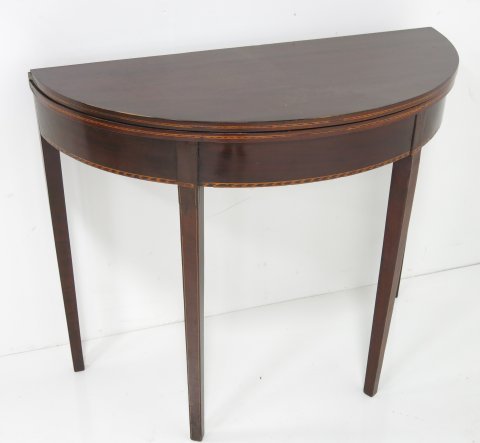19th c. English demilune mahogany card table: With string inlays, flip top. Approx. 28.5" H x 17.5" D x 35" across. Surface scratches.