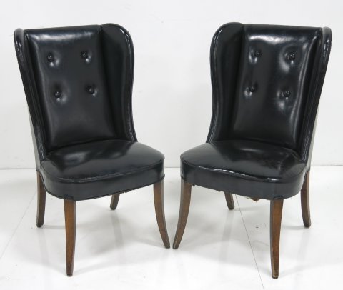 Pair of black leather wingback chairs: Approx. 41" H. Legs slightly splayed.