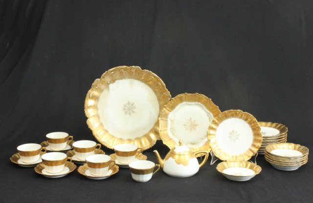 Partial Limoges gilded dinnerware set: Some chips & wear to gilding.