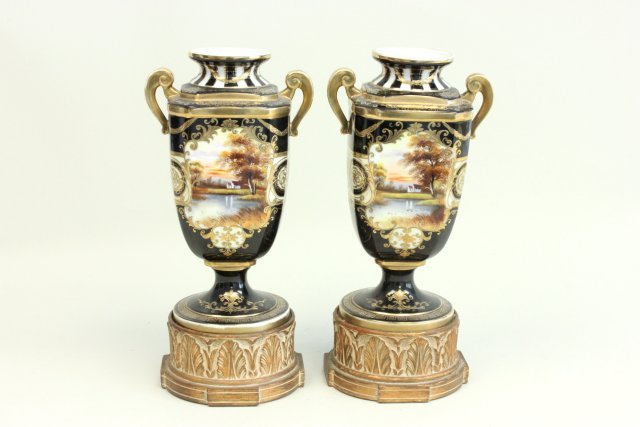 Pair scenic porcelain vases mounted on wood bases: Possibly Nippon. Approx. 9.75" H without base, 12.25" H with base. Good condition.