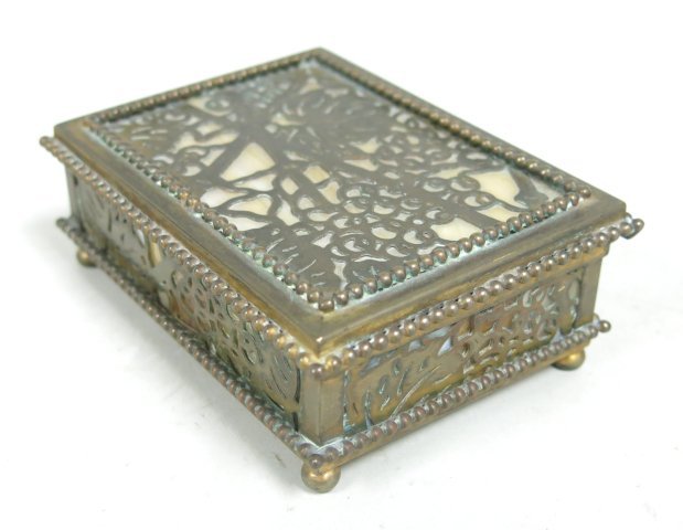 Tiffany Studios, New York hinged box: Slag glass. Approx. 4 5/8" W x 3 1/8" D x 1 1/2" H.