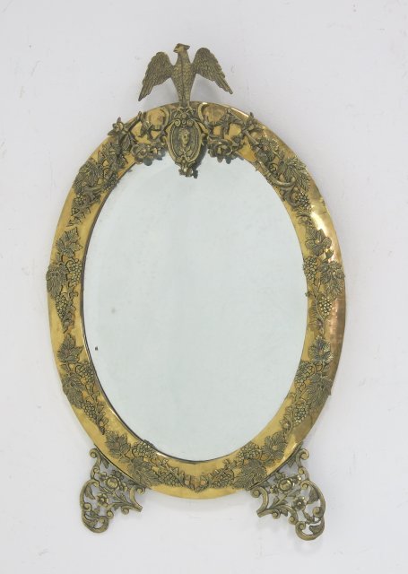 Oval brass mirror with "Eagle Crest": Approx. 32" x 20".