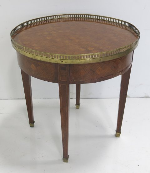 French Bouillotte table: Parquetry inlaid, brass gallery. Approx. 21" H x 21" D. Some veneer loss