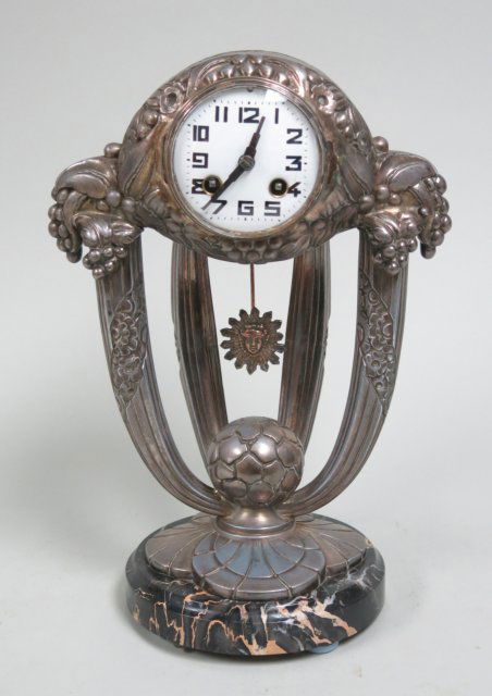 Art deco silvered metal clock: with sunburst pendulum, Japy Freres movement Approx. 14 1/2"H good condition