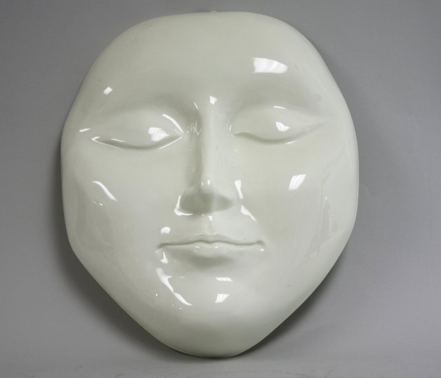 Space Age plastic face: Approx. 20" H x 16" W. Chip to top.
