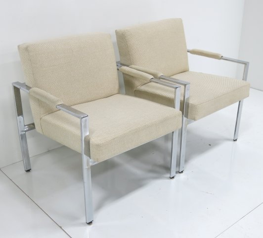 Milo Baughman pair of chrome armchairs: Ca. 1965. Upholstered in woven jute. Approx. 30" H x 27" W x 28" D.