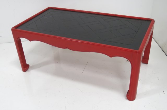 Baker red painted coffee table: In the Chinese taste. Approx. 16 1/2" H x 41" W x 22 1/2" D.
