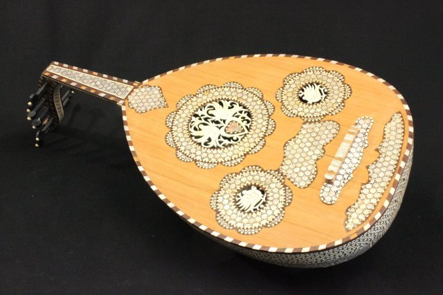Syrian Mother of Pearl Inlaid Oud: 20th century. Approx. 33" H. (4034) Property of a lady, UN Plaza, NYC. Missing veneer, 2 keys & strings, crack in back near neck.