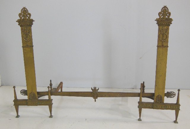 Pair bronze andirons with "Wreath & Torch" design: "Dolphin" tops. Approx. 27 3/4" H x 9 3/4".