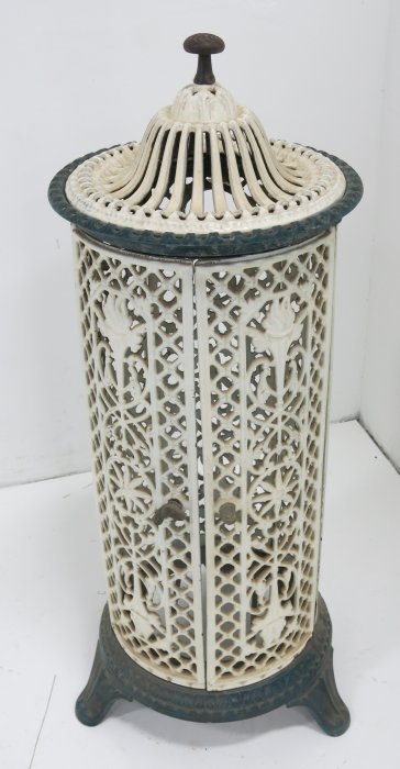 Victorian wrought iron stove: Cylindrical. Vestor Martin. Approx. 40" H x 14" D.