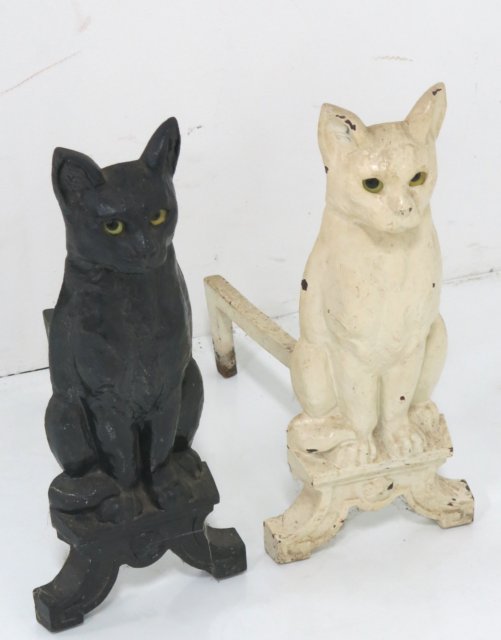 Pair of black and white cat andirons: Cast iron with glass eyes. Approx. 18" H.