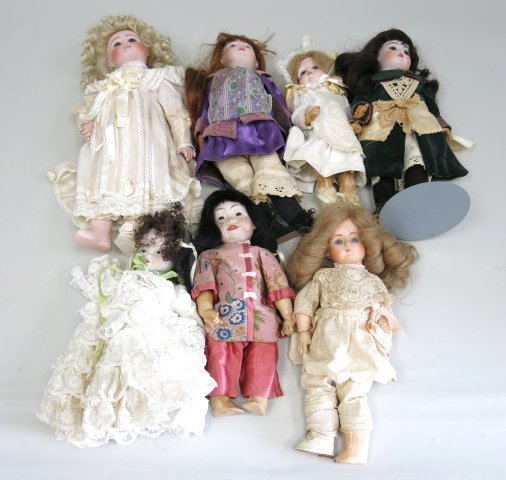 7 Dolls\: 6 bisque head dolls & 1 composition head doll including, 1 Ann Brown JDK #243, 1975; 1 Ann Brown Stiener, 1978; 1 Ann Brown Jamaica, 1978; Jan Doehmer A 15, Paris 1986 - New Orleans; & others.
