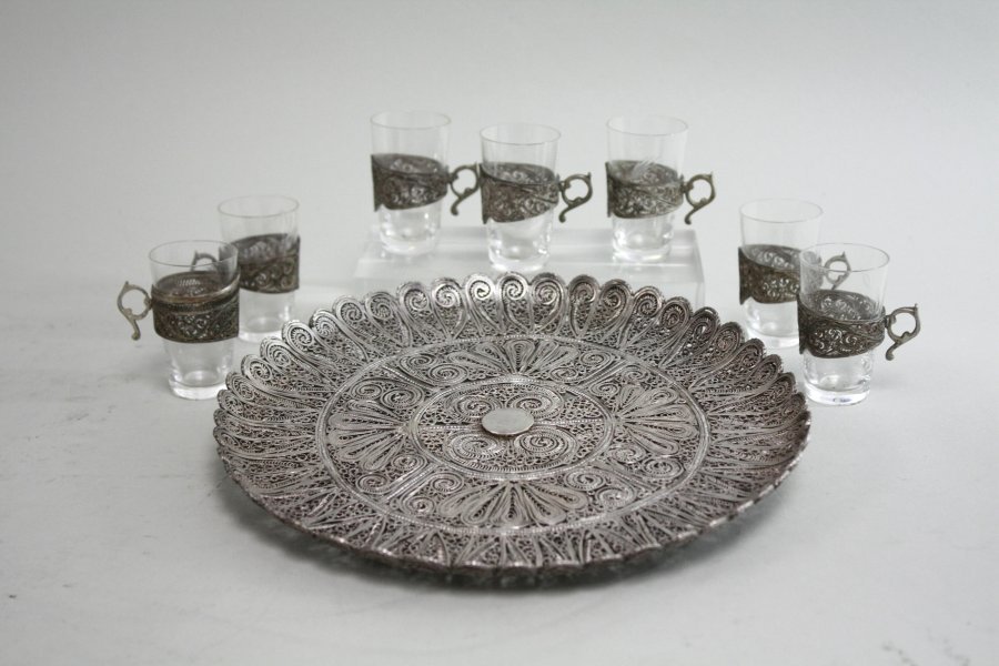 Persian Round Filigree Tray & 7 Shot Glasses: Tray, unmarked & tested for silver approx. 8 1/2" D. Approx. 565g, 18.2ozt. From a Great Neck, NY Estate. Missing filigree in center of tray.