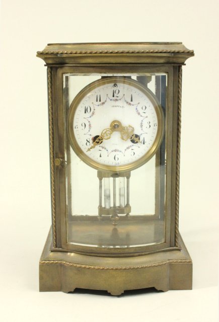 Crystal & Brass regulator clock with enameled face: Enameled face, Tiffany & Co., France with mercury pendulum, 10 1/4"H, works stamped Made in France. From a NYC collector's 40 year compilation. Good condition with key.