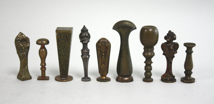 Group of 9 bronze & metal seals, 1 sterling silver (1 of 8)