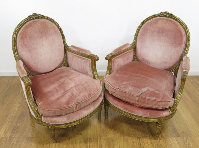 Pair of Gilt Wood French Bergeres: With pink upholstery. Ca. 1900's. Approx. 41" H x 29 1/2" W arm to arm x 18" H seat x 23" D.